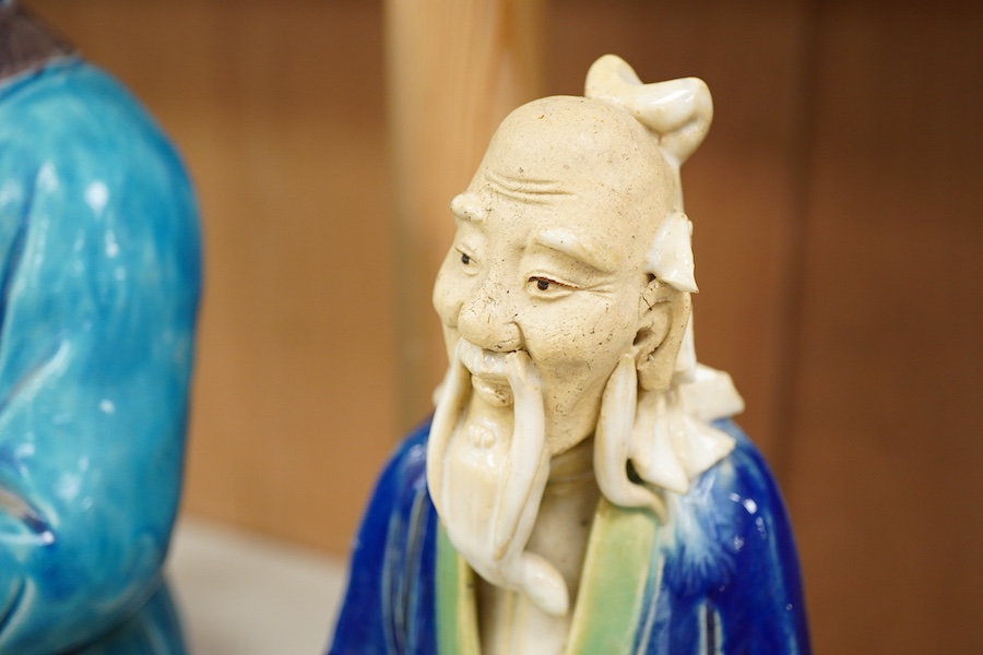 Two Chinese pottery glazed figures to include a Shiwan mudman, largest 48cm high